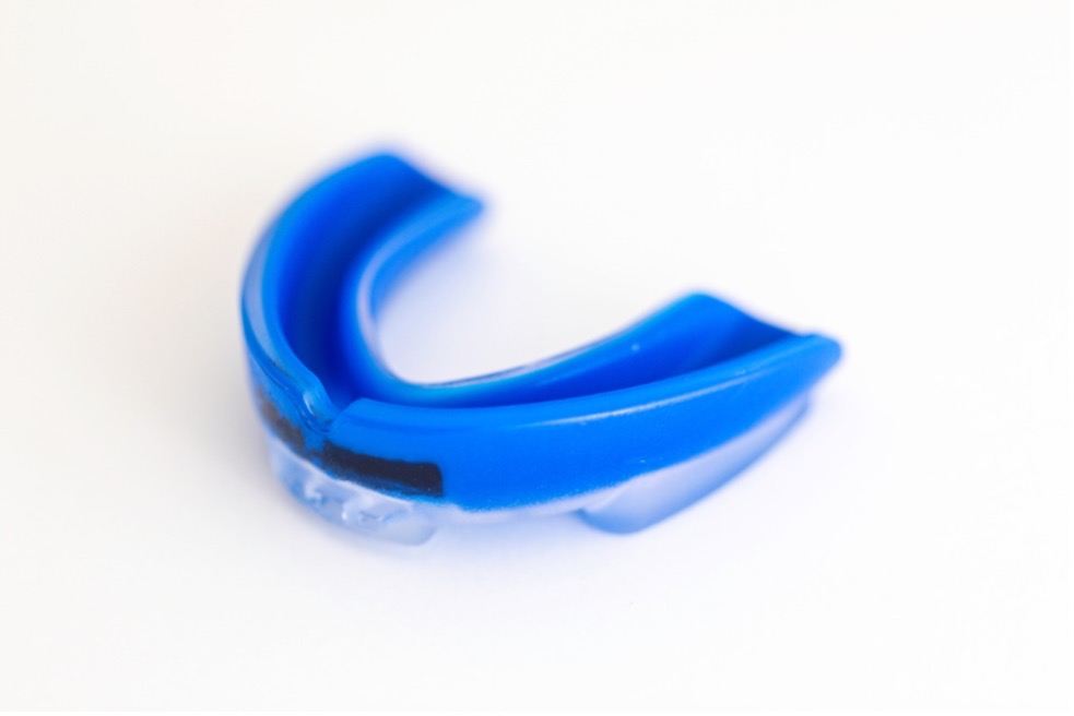 A picture containing blue, plastic, sports mouth guard