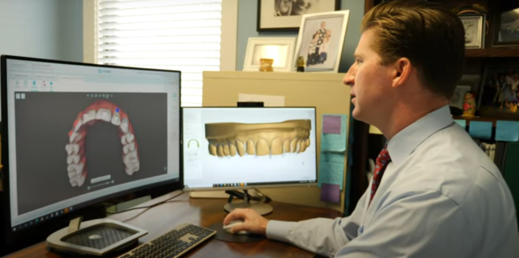 A person looking at a computer screen, What to Expect as a Student Getting Clear Aligners